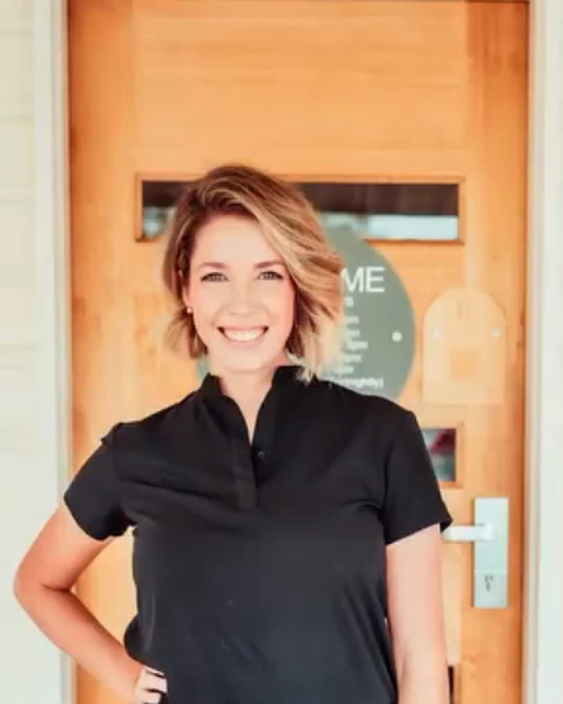 Sammie, owner of Blush Boutique, at her clinic door